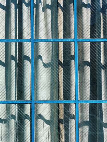 prison gray curtain and brown framed clear glass window during daytime 1151 howard st